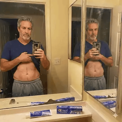 Gary trying on pants that finally fit